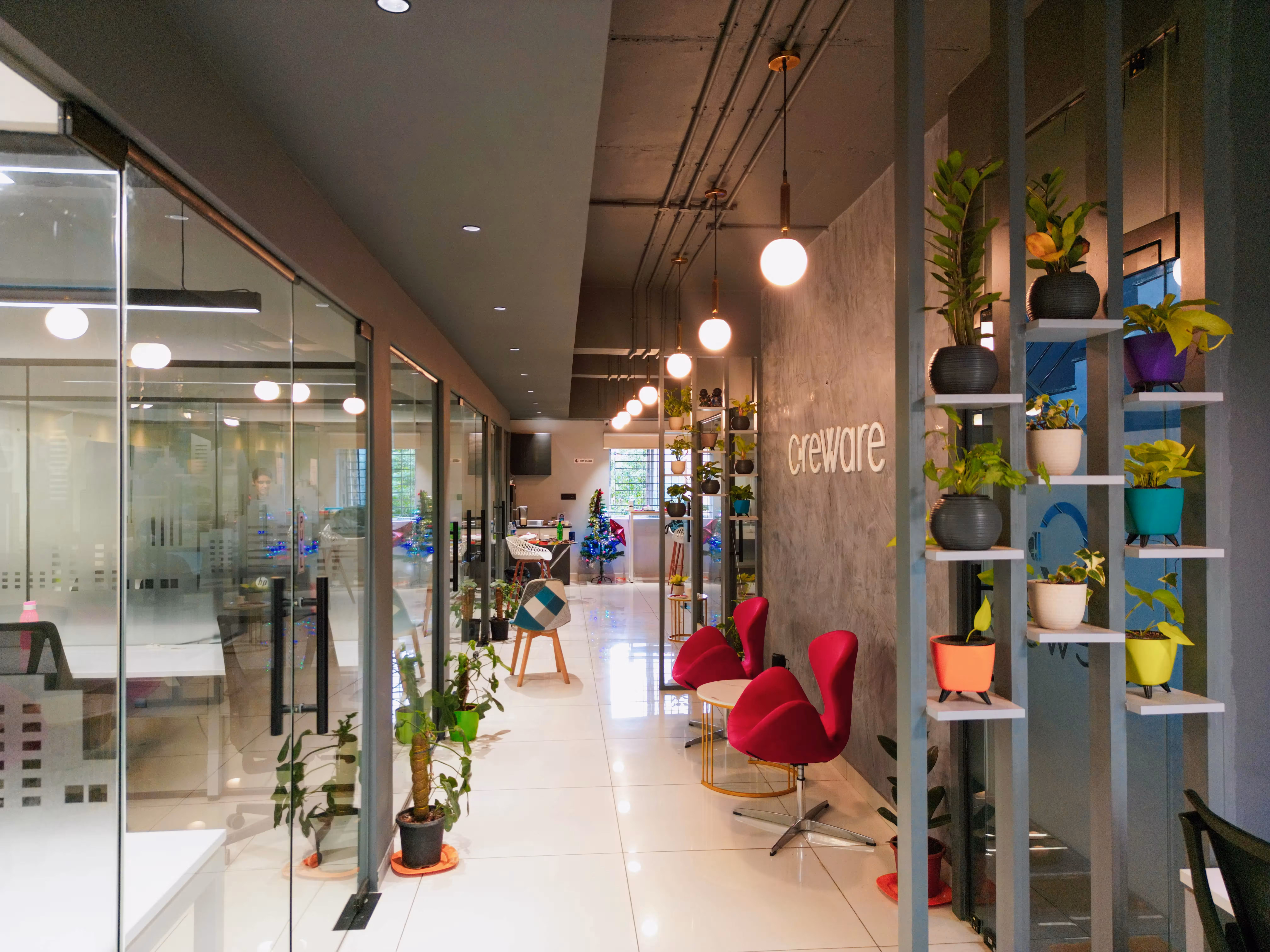 Creware wall with red chairs at Bangalore
