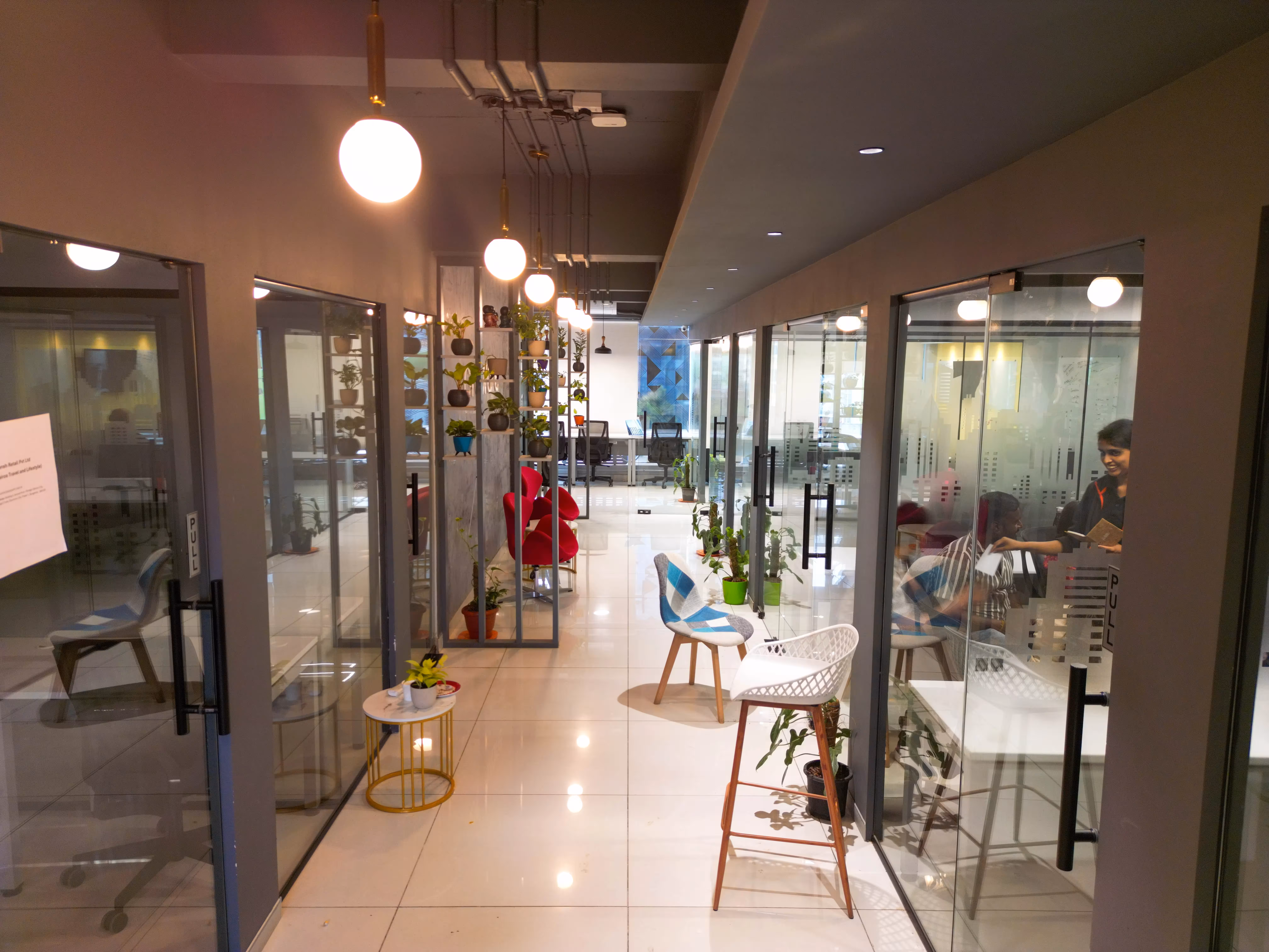 Lounge corridor with globe lights at Creware Bangalore