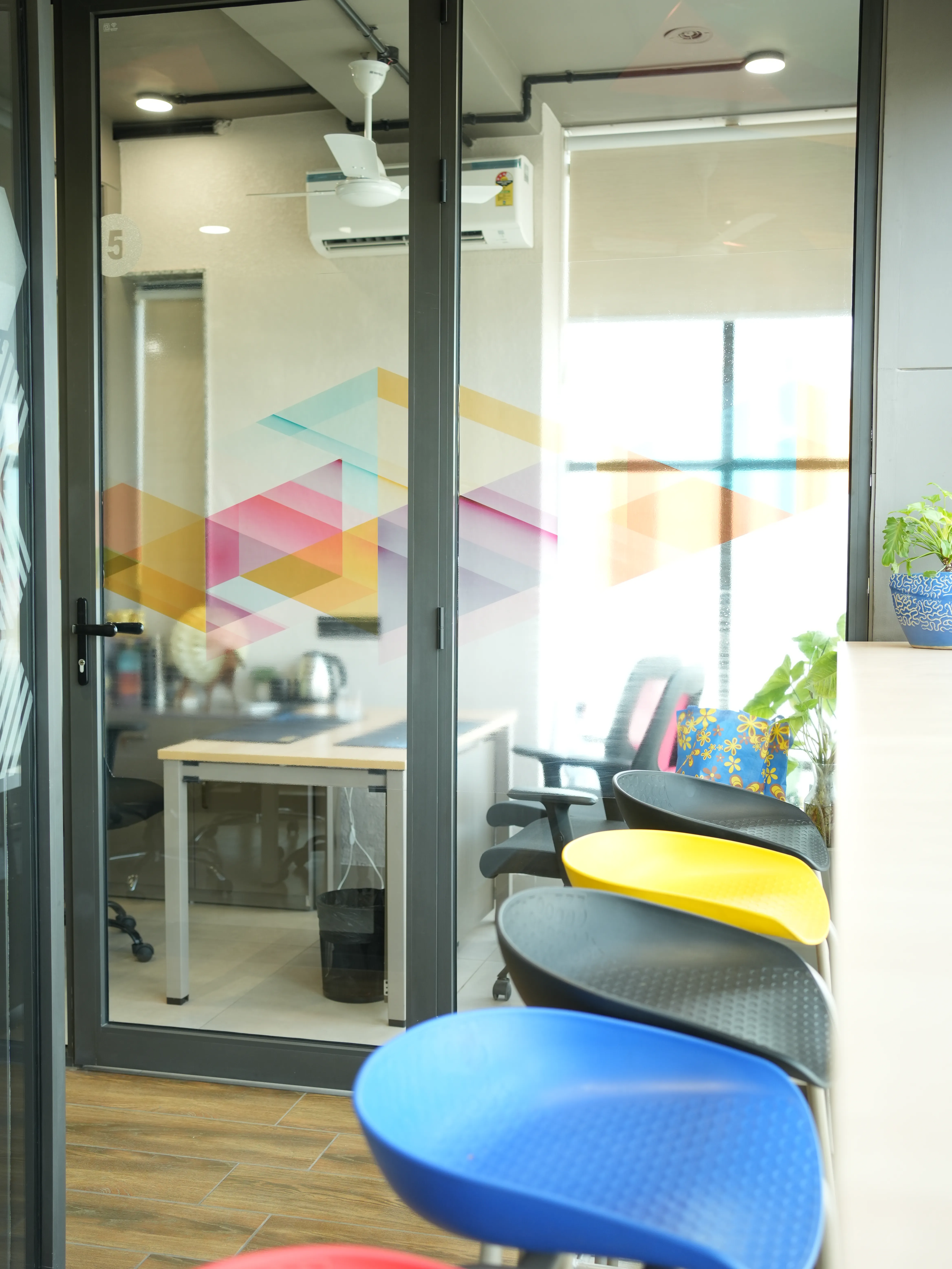 Cabin with geometric mural at Creware Malviya Nagar