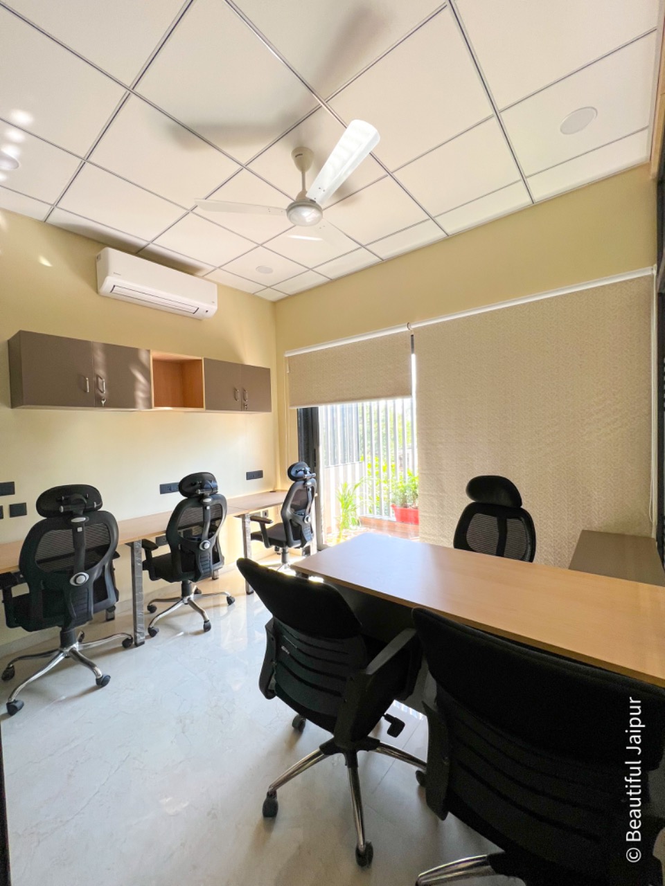 Airy private office with balcony garden view